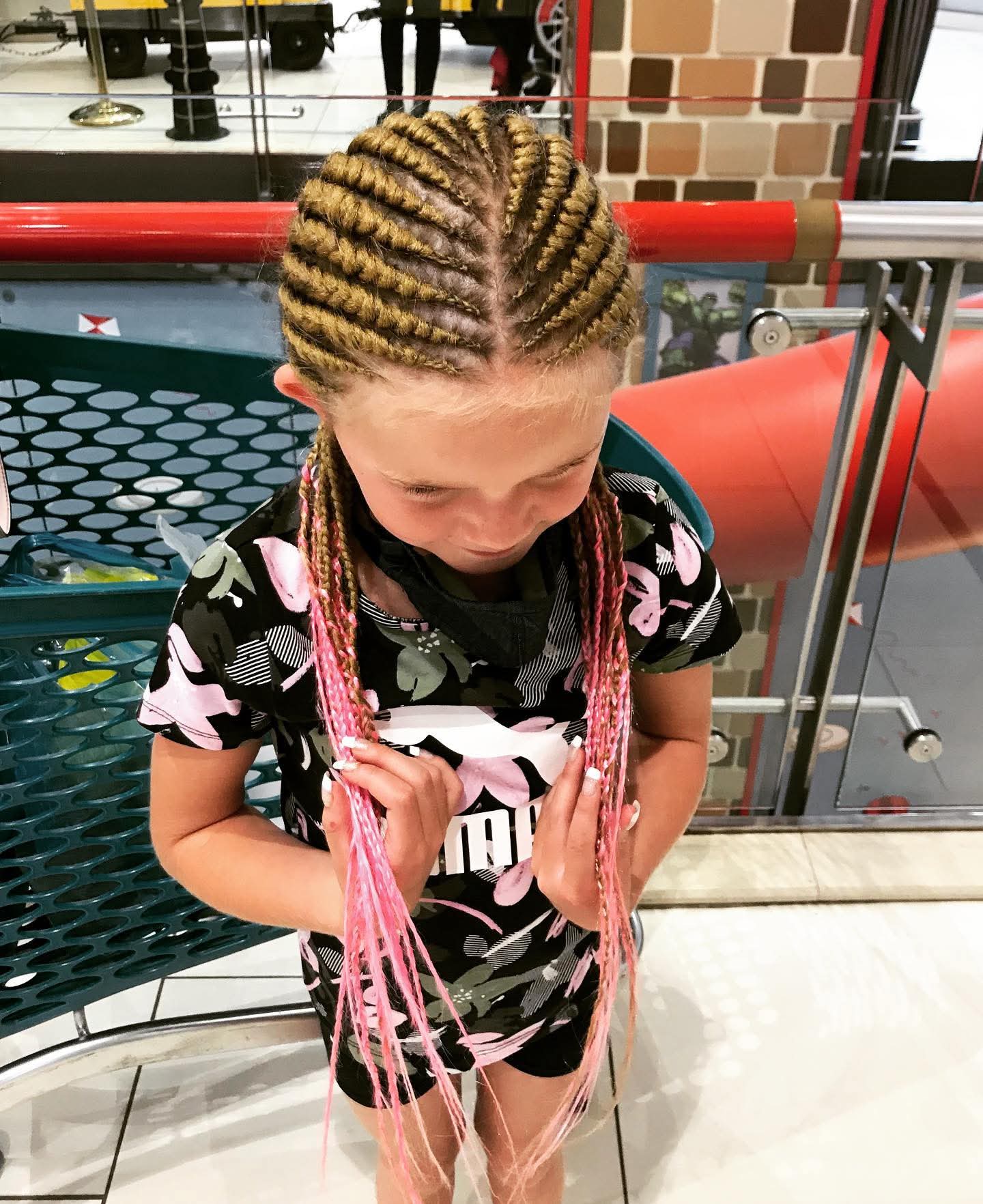 Straight-back cornrows with pink braid extensions for kids