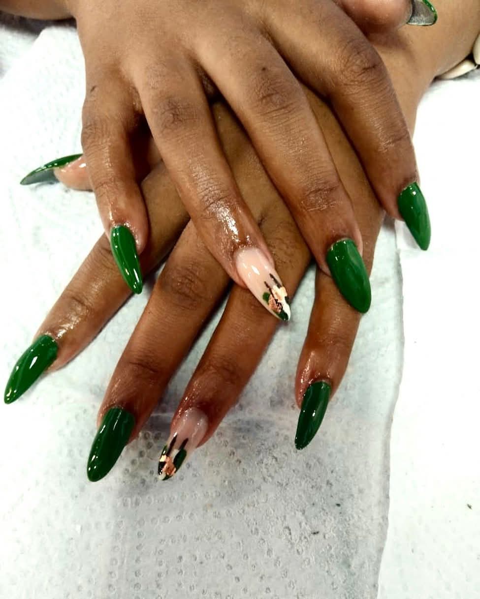 Deep emerald green gel nails with gold accent art