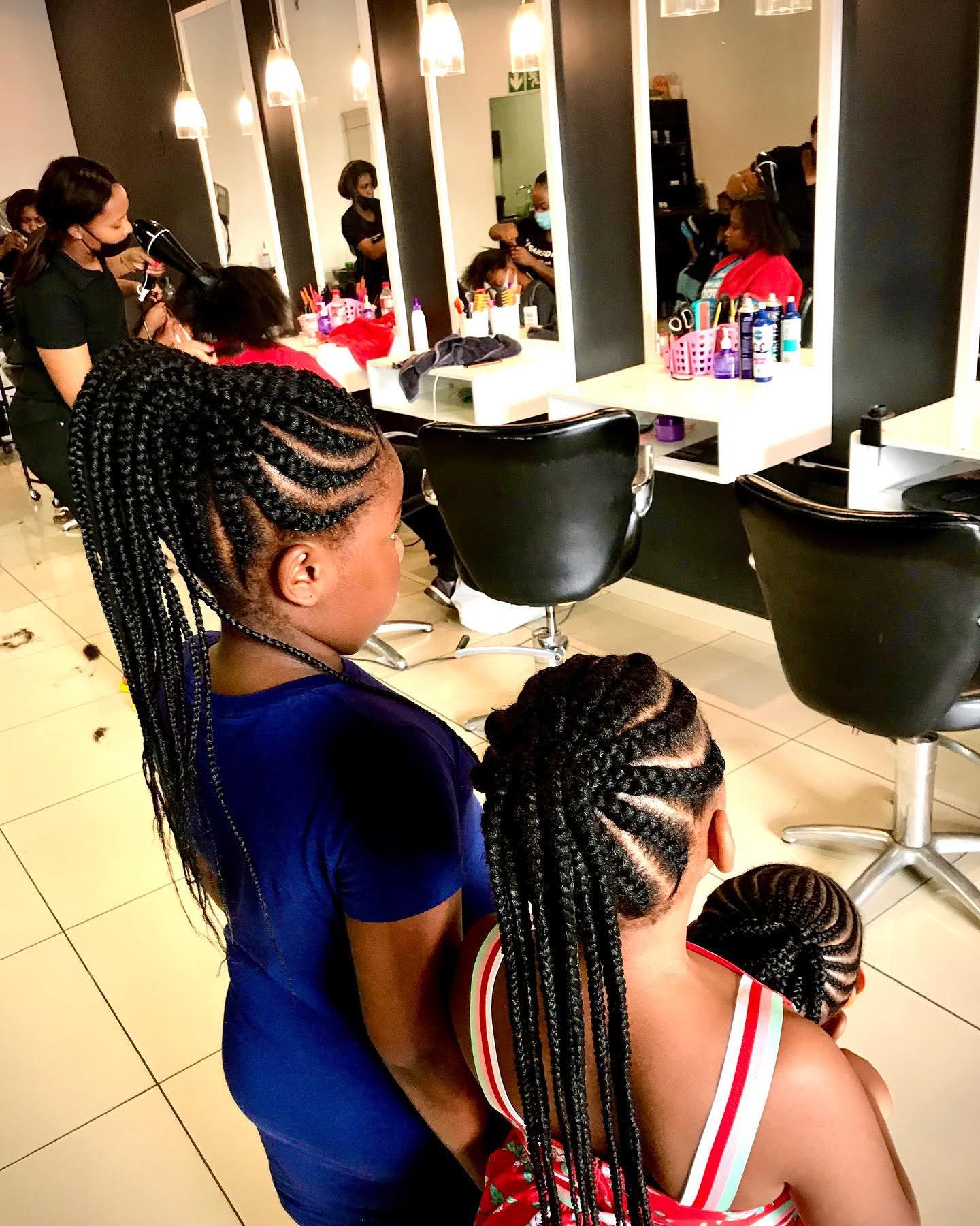 Matching mother and daughter stitch cornrow ponytails